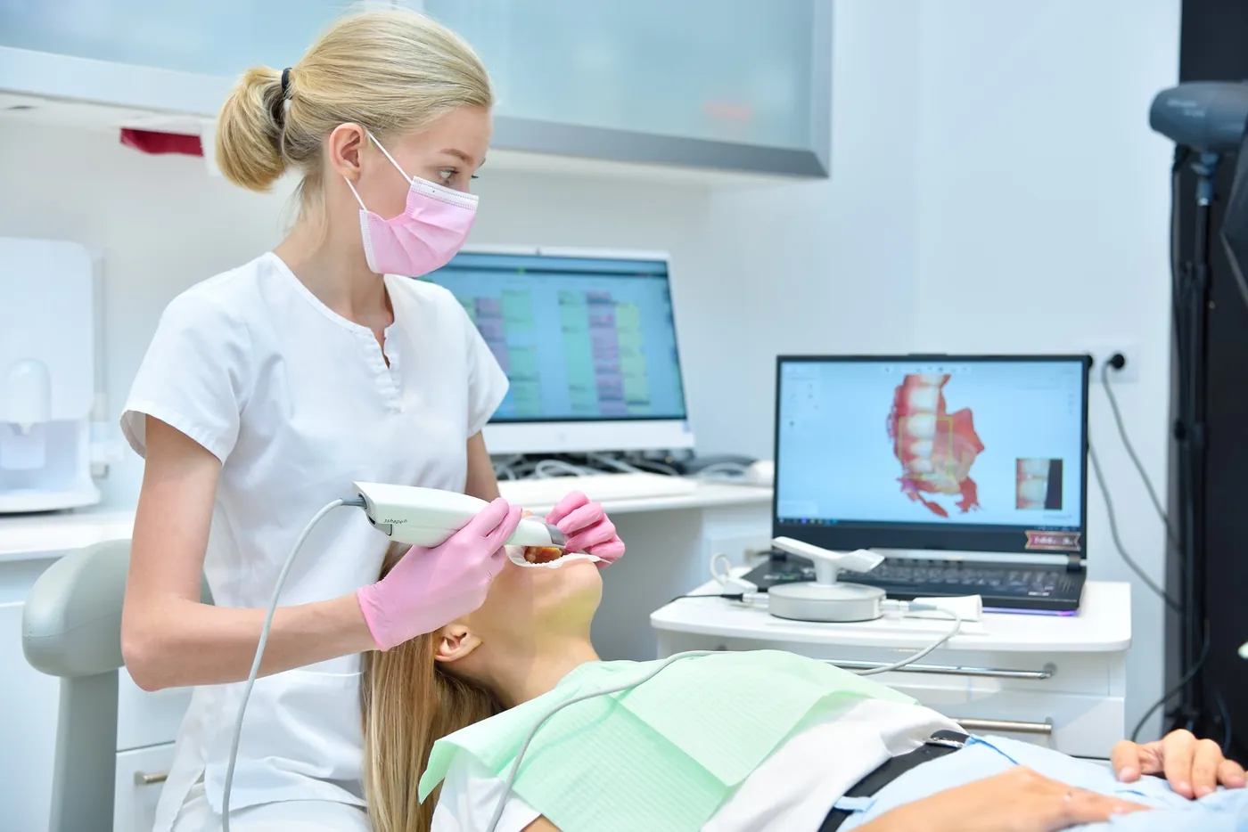 Clinician taking a digital intraoral scan