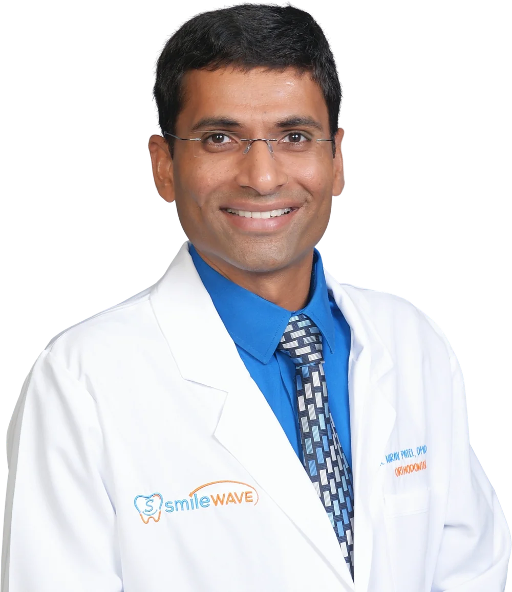 Dr. Nirav Patel, orthodontist, in a Smilewave lab coat